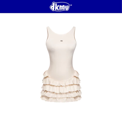 Đầm kiểu nữ hở lưng đan dây ôm dáng DKMV có quần trong màu kem xòe xếp tầng đính logo inox Cá Twinkle Dress | K-D7-K