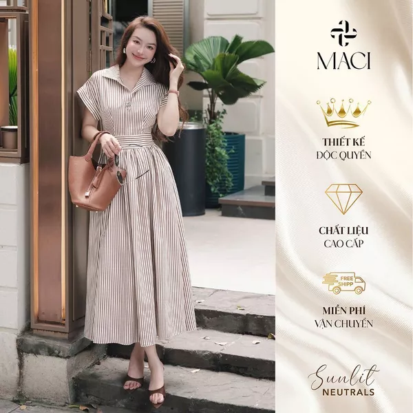 Đầm Sơ Mi Dáng Xoè Cổ Bẻ Tay Lơ Vê Kẻ Nâu Chất Thô Cotton Kèm Khuy Trang Trí MACI MCVVAKE0374