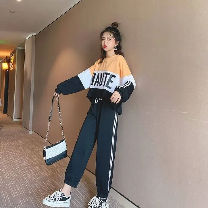 Tự tin dạo bước cùng mẫu trang phục được mix từ quần thể thao và áo Sweater dáng rộng